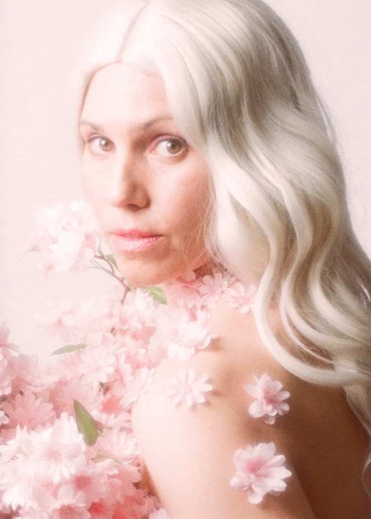 self portrait photograph with cherry blossoms