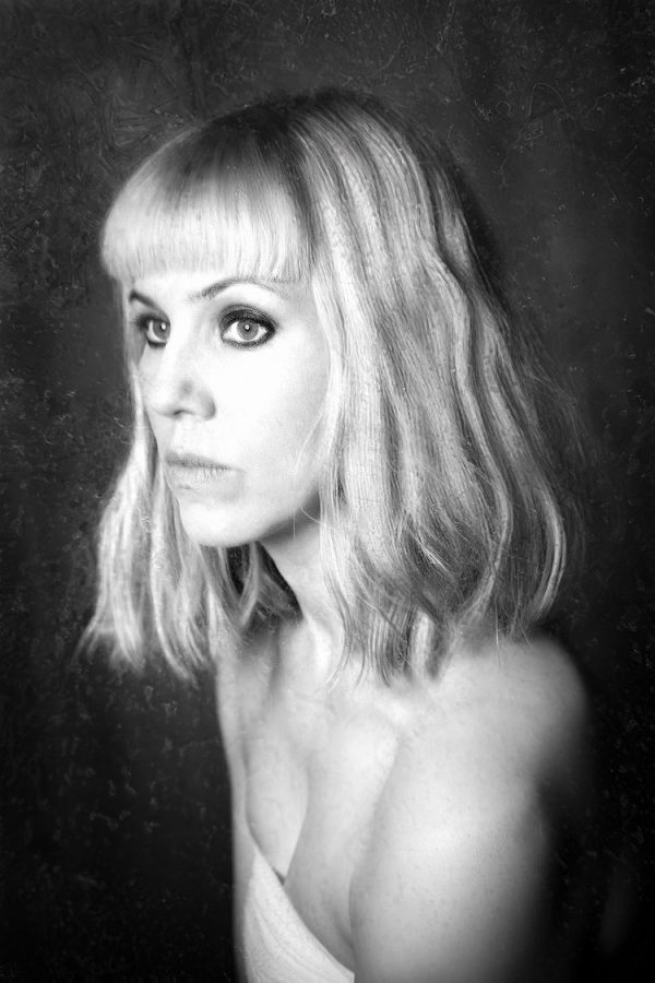 black and white portrait of sad looking woman. blog post about Photography Self Expression