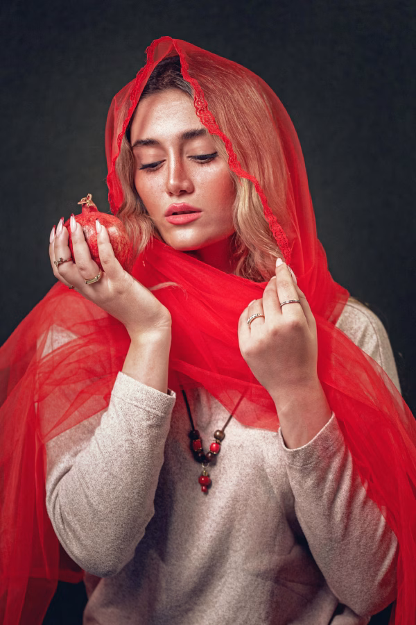 fine art portrait of a woman with red scarf