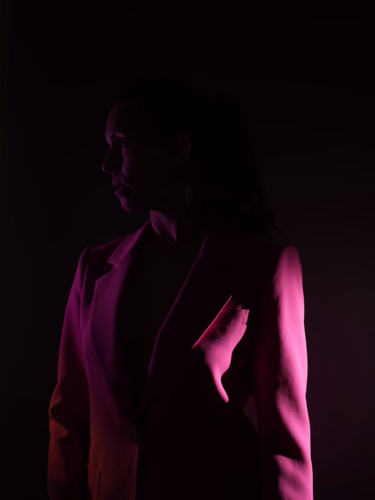 photo of woman in pink blazer