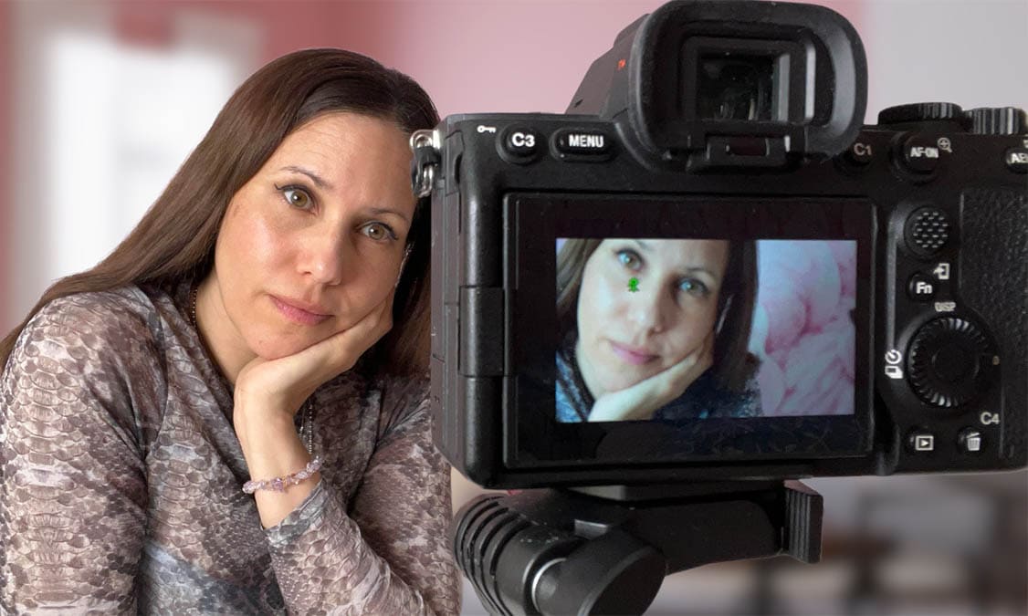 close up of a woman and a camera screen